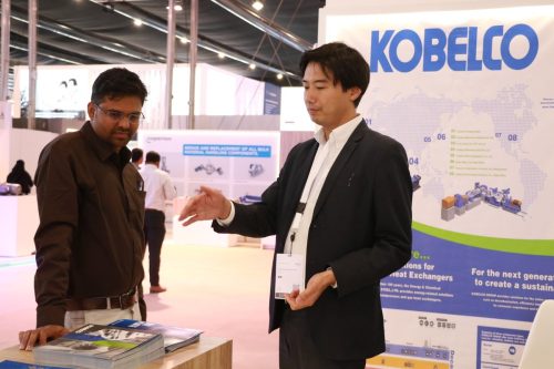 Product literature and discussions at Kobelco counter